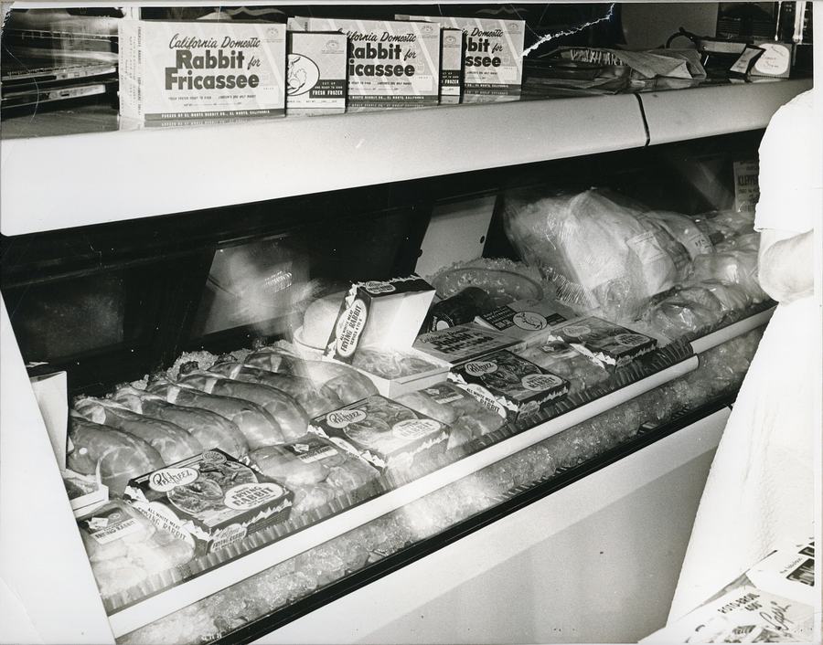 Pel-Freez Brand frozen rabbit on display in a retail freezer case